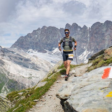 a man hiking on a mountain a man hiking on a mountain