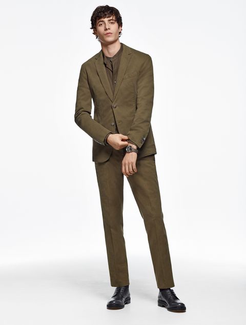 Suit, Clothing, Standing, Formal wear, Khaki, Blazer, Outerwear, Brown, Fashion, Suit trousers, 