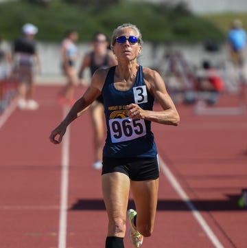 a woman running on a track