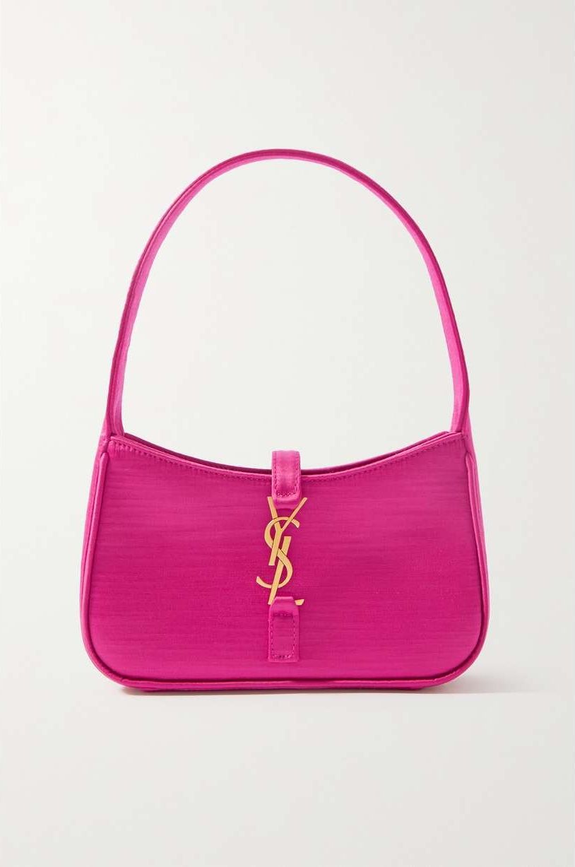 a pink purse with a key