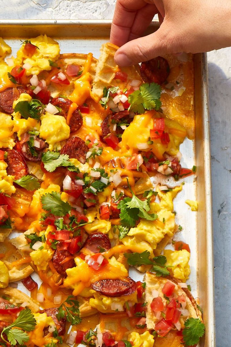 waffle nachos with scrambled eggs, sausage and tomatoes