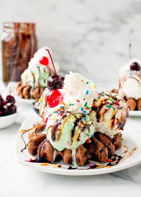 brownie batter waffle ice cream sundaes with cherries and sprinkles