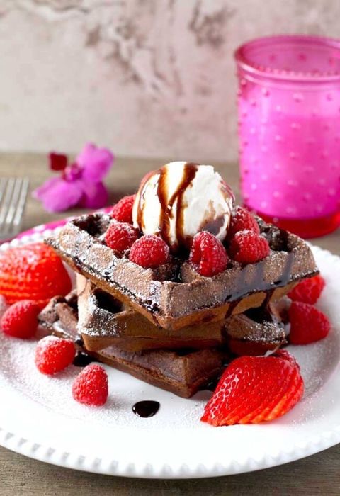 double chocolate waffles with raspberries and strawberries and vanilla ice cream