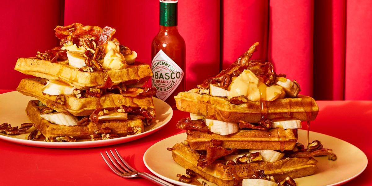 waffles with spicy glazed bacon and pecans against red curtain
