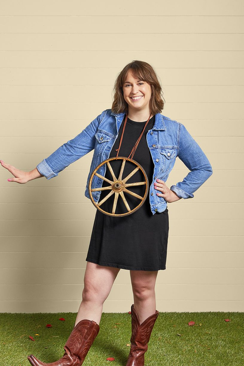 woman wearing jean jacket and wagon wheel necklace for wagon wheel country mustic halloween costume