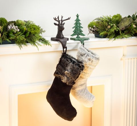 how to hang garland, hanging hacks, holiday stockings by the fire with cast iron holders