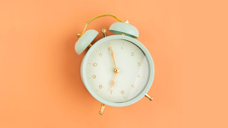 alarm clock vintage style on the yellow background, position with copy space
