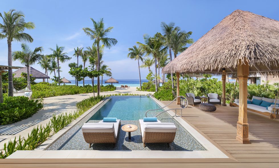 the pool deck at the waldorf astoria ithaafushi in the maldives