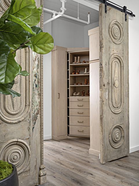 wardrobe
a 360 degree rotating closet system
by closet works features a hidden
full length mirror and ample storage
for shoes sourced from the corbel,
the french doors that close off
the space are from the 1800s