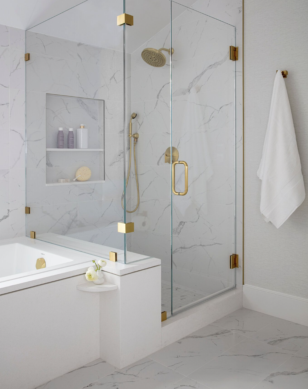 https://hips.hearstapps.com/hmg-prod/images/walk-in-shower-ideas-gold-fixtures-643ac8028429a.png