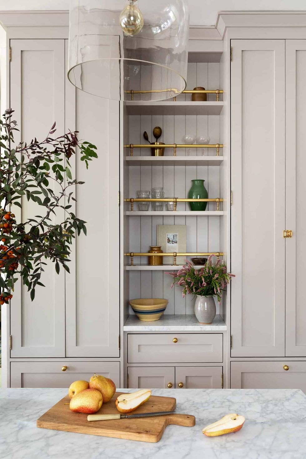 https://hips.hearstapps.com/hmg-prod/images/wall-storage-ideas-seattle-interior-designer-heidi-caillier-design-dining-room-phinney-ridge-craftsman-home-design-kitchen-inset-shaker-cabinets-bauman-chairs-small-island-industrial-pendant-light-1642194868.jpg?crop=0.879xw:1.00xh;0.0748xw,0&resize=980:*