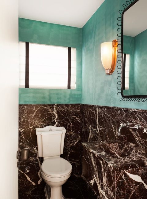 bathroom with turquoise wallpaper