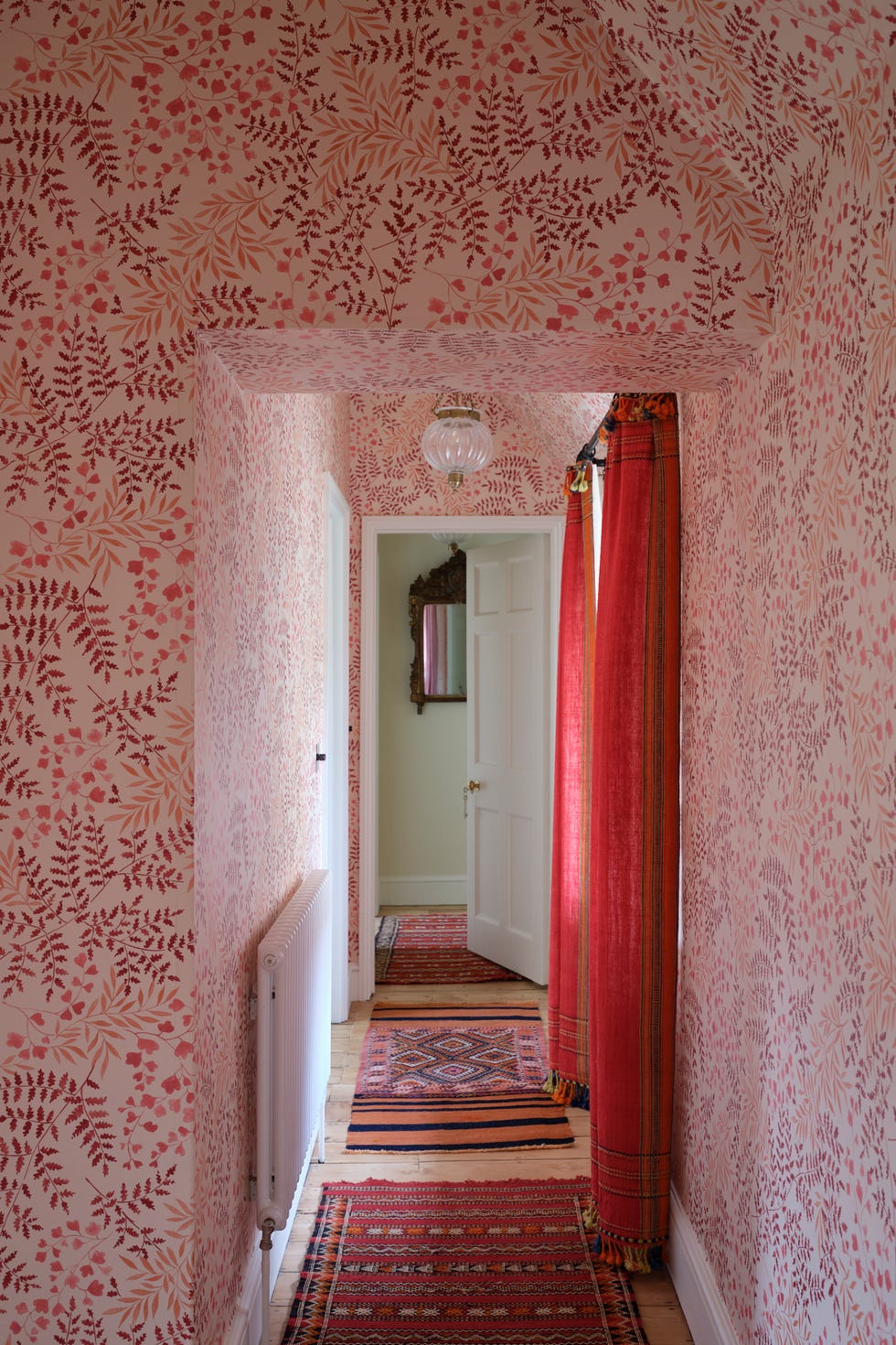 hallway with red botanical wallpaper and red curtains hallway with red botanical wallpaper and red curtains