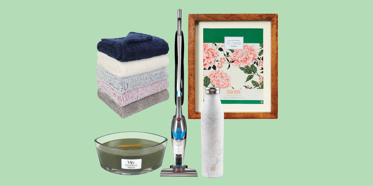 blankets, vacuum, candle, picture frame, and water bottle grouped together with green background