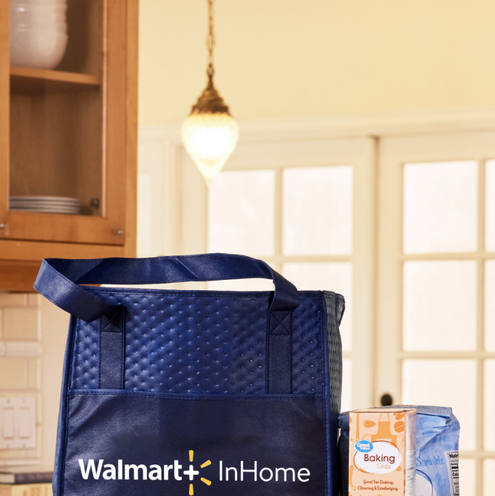 walmart plus in home blue insulated bag with groceries on a wooden kitchen table