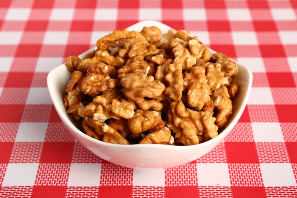 shelled walnuts in white bowl