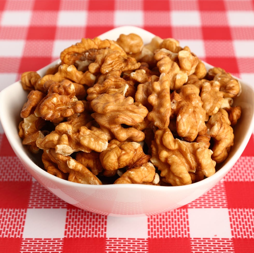 Shelled Walnuts in white bowl shelled walnuts in white bowl