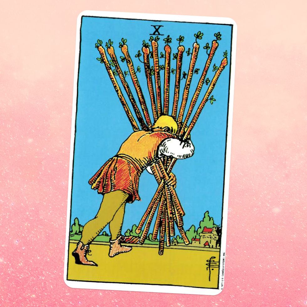 the ten of wands tarot card, showing a man from behind, holding a pile of ten giant wooden sticks in his arms