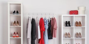 wardrobe shelves with different stylish shoes and clothes indoors idea for interior design