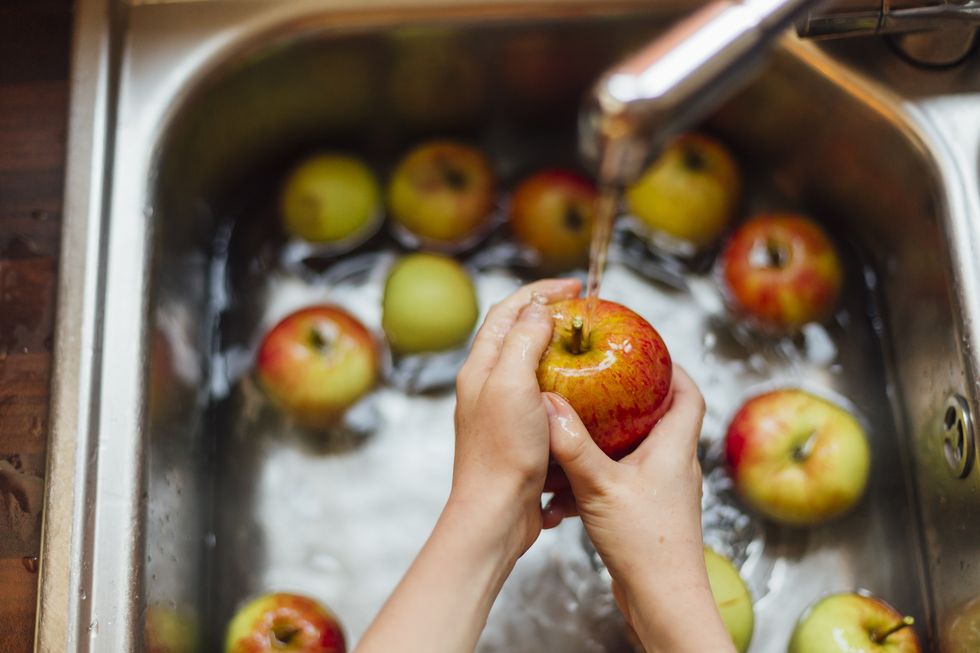 Washing apples in sink