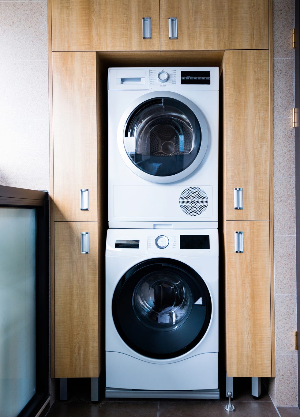 Washing machine and tumble dryer in modern apartment