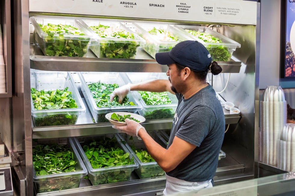 washington dc, chinatown, chop't, restaurant server getting greens for salad preparation