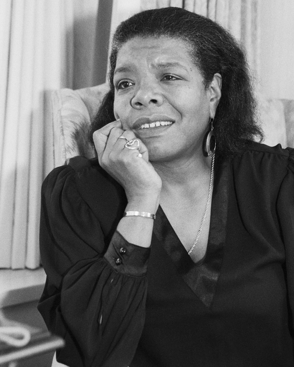 maya angelou smiling and propping up her head with her right hand