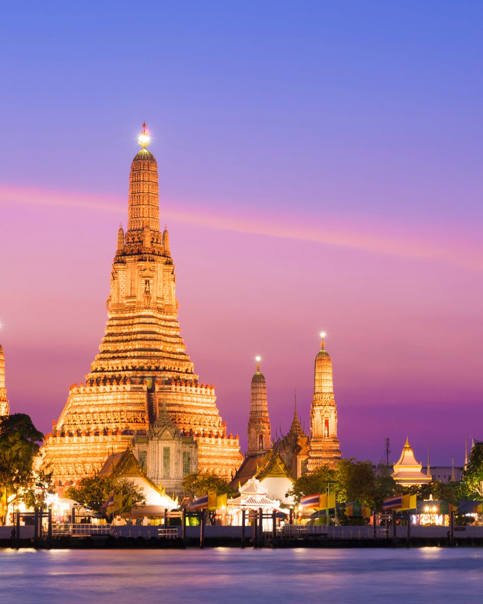 wat arun temple at sunset in bangkok, thailand