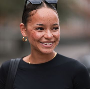 hamburg, germany august 25 naomi amissah seen wearing black sunglasses, gold earrings and necklace, black cropped shirt, black structured leather shopper bag, grey suit pants, on august 25, 2023 in hamburg, germany photo by jeremy moellergetty images