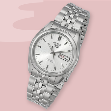 a silver watch with a white face