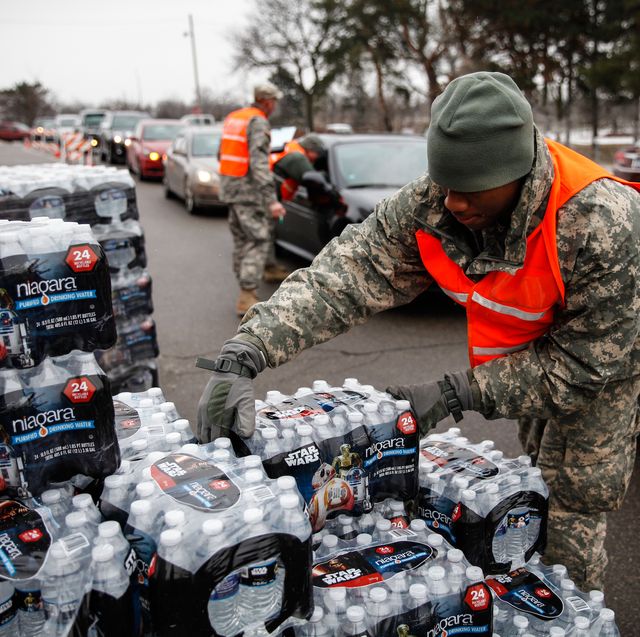 flint, mi   january 21  army national guard specialist david brown loads bottled water into waiting cars at a fire station on january 21, 2016 in flint, michigan residents can go daily to fire stations in the city to pick up more water  photo by sarah ricegetty images