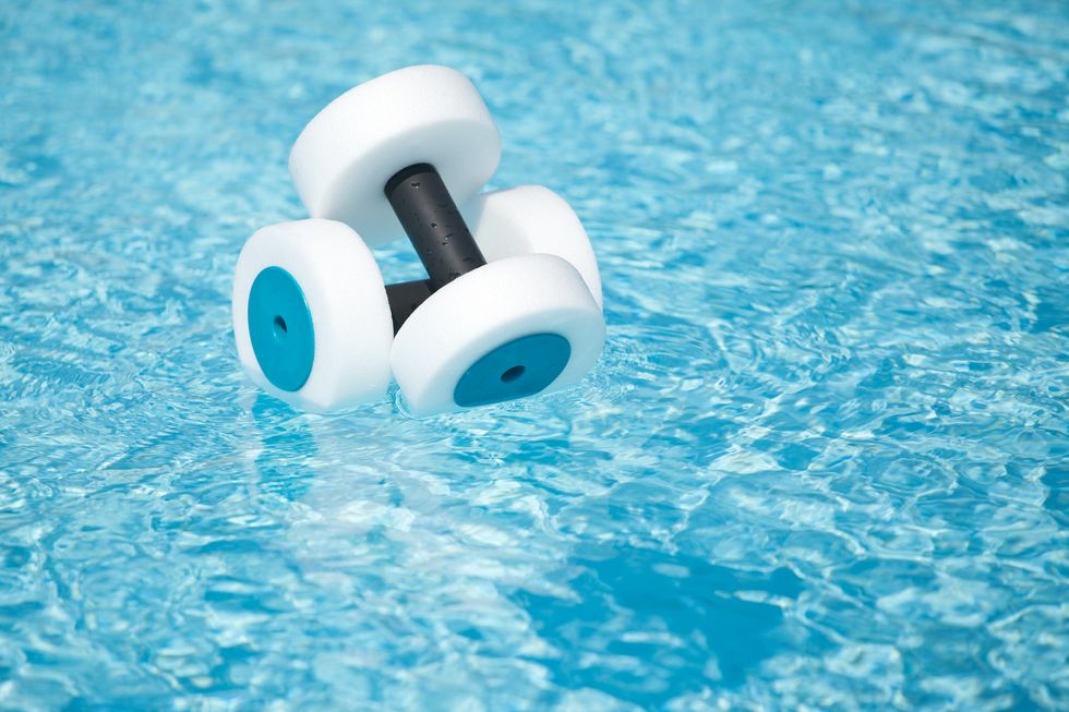 water fitness hand buoys floating in pool