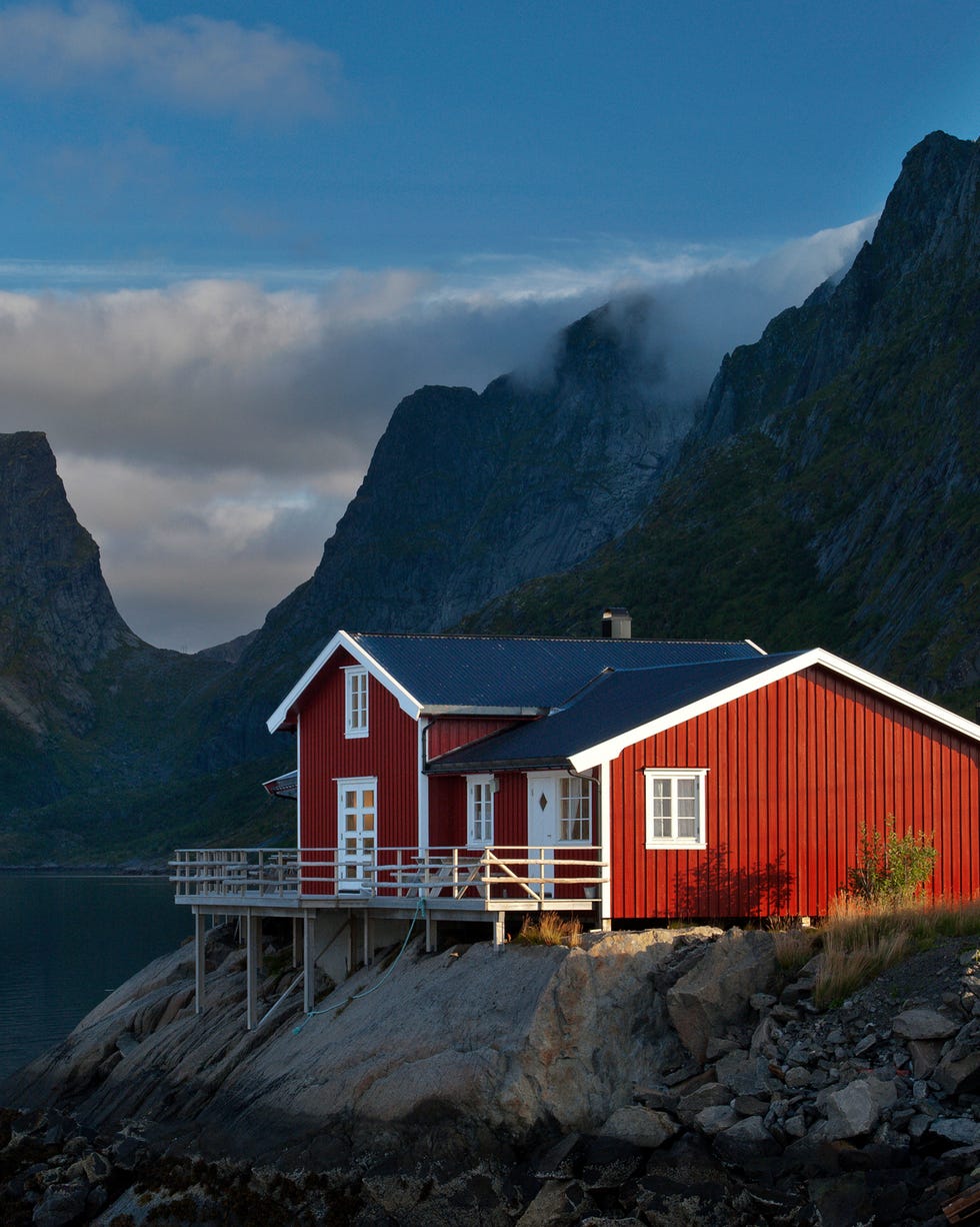 waterfront buildings with peaks in background