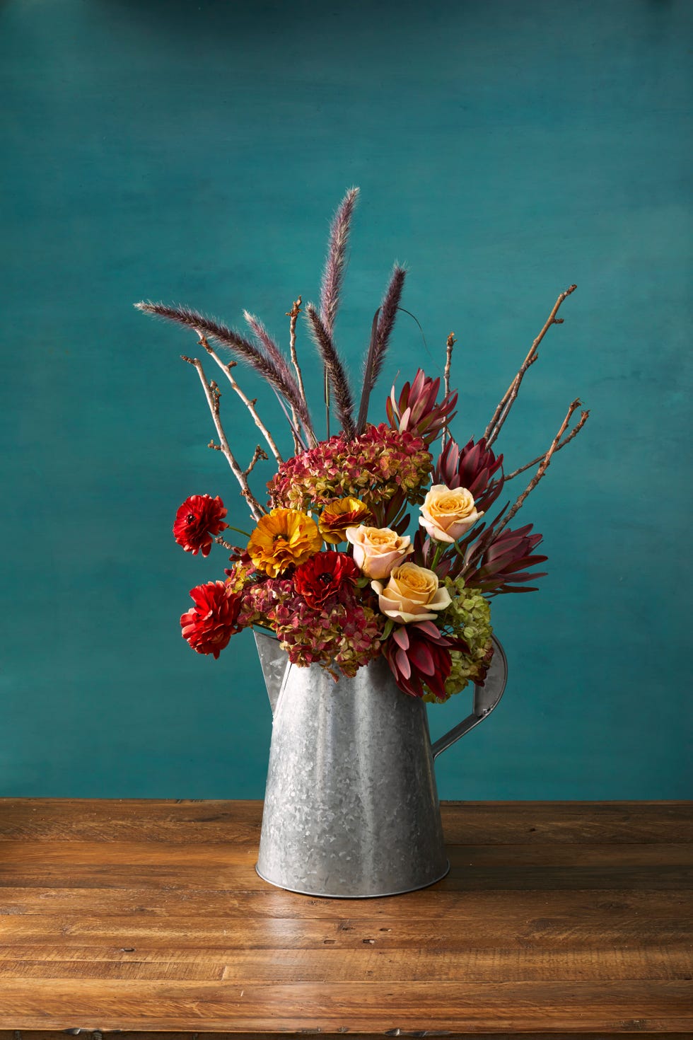 beautiful pitcher autumn flower arrangement