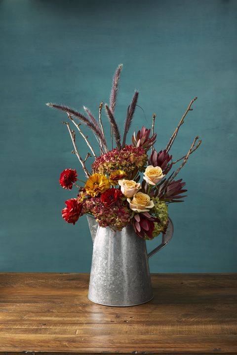 pretty pitcher autumn flower arrangement