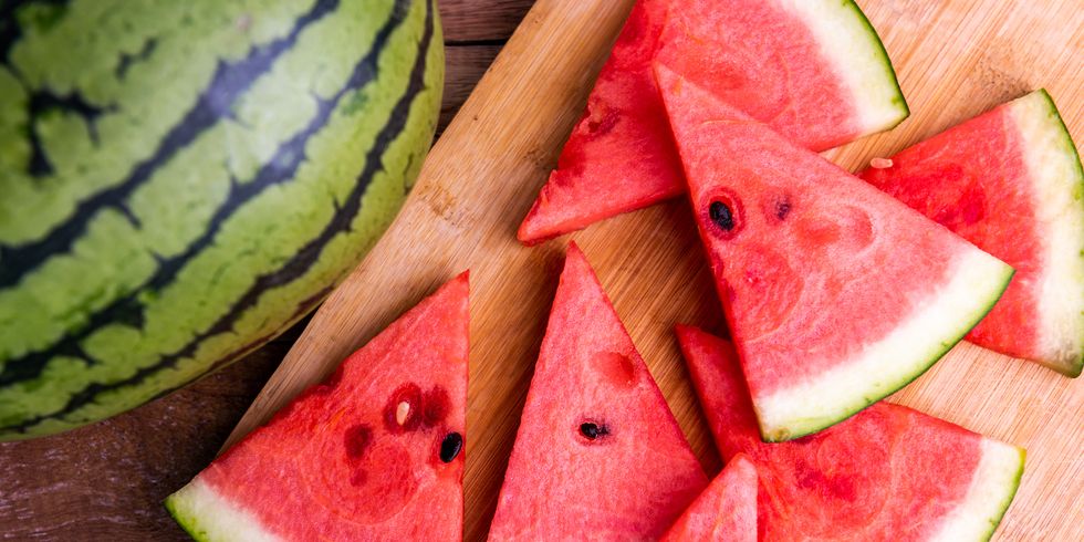 fresh ripe watermelon slices on wooden table