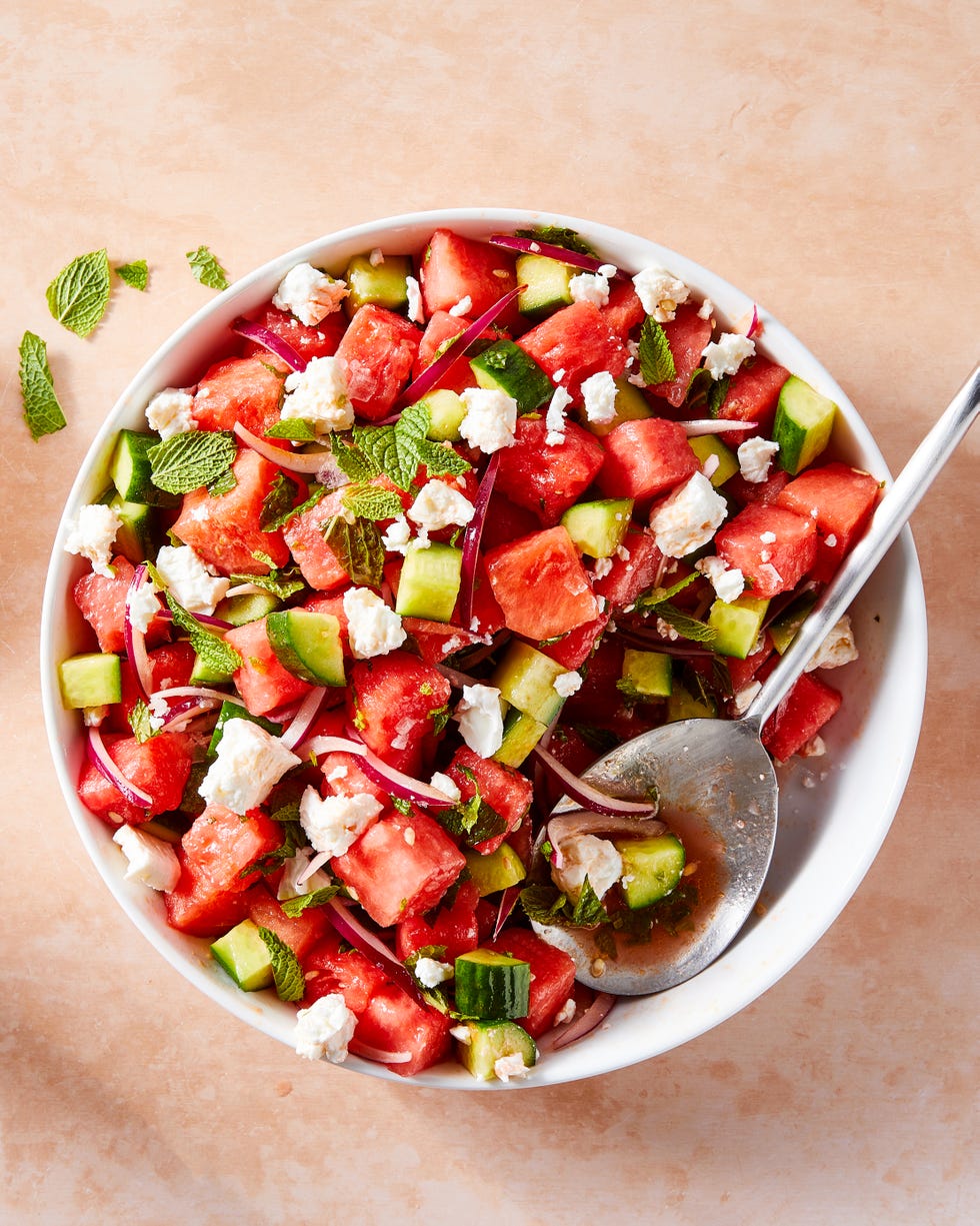 watermelon cubes, feta, red onion, and mint in a bowl