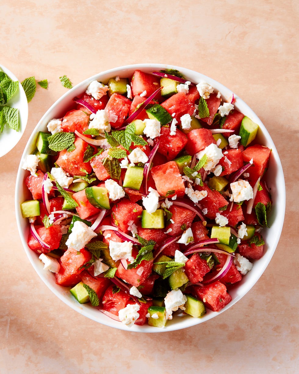 watermelon cubes, feta, red onion, and mint in a bowl