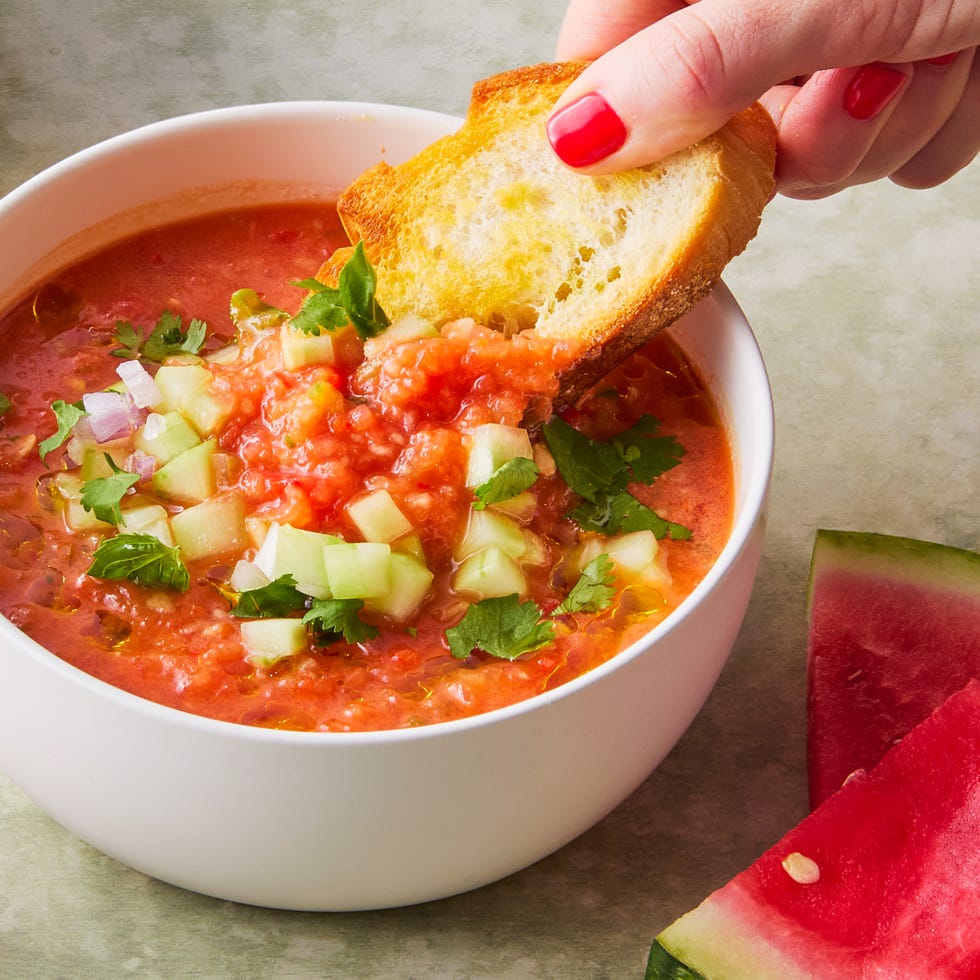 watermelon gazpacho topped with cucumber and red onion