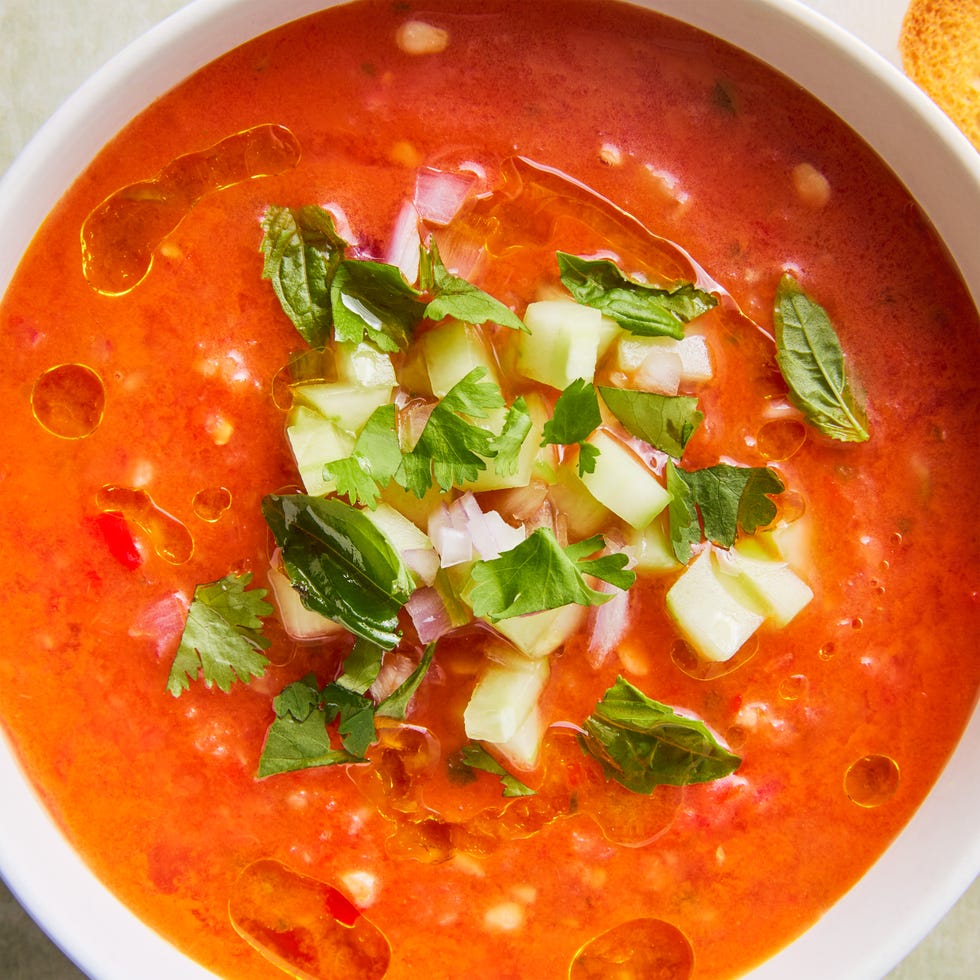 watermelon gazpacho topped with cucumber and red onion