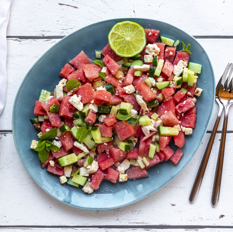 watermelon salad with feta, cucumber, mint and lime dressing on plate