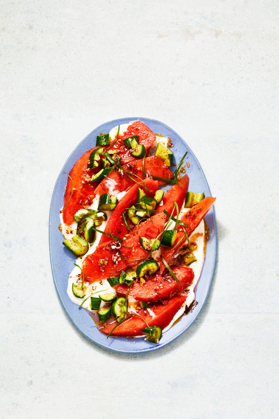 watermelon salad with cucumber on a blue plate
