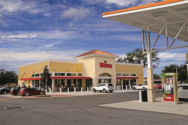Building, Filling station, Sky, Rest area, Architecture, Gasoline, City, Outlet store, Mixed-use, Plaza, 
