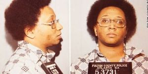 Hair, Forehead, Nose, Hairstyle, Chin, Album cover, Jheri curl, Afro, Eyewear, Glasses, 