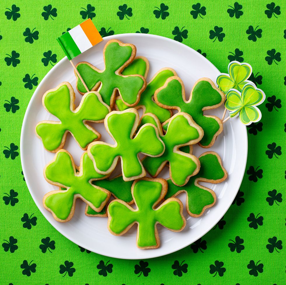st patricks day activities plate of shamrock cookies with green icing