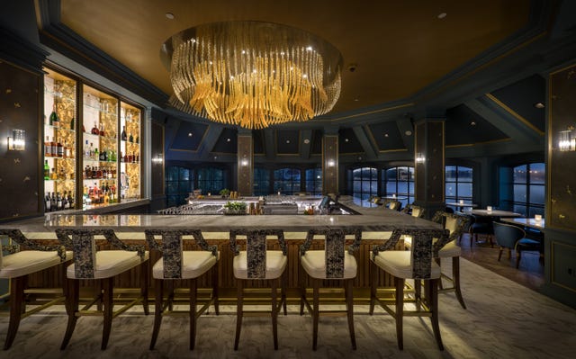 Building, Room, Interior design, Lighting, Table, Ceiling, Architecture, Furniture, Restaurant, Chandelier, 