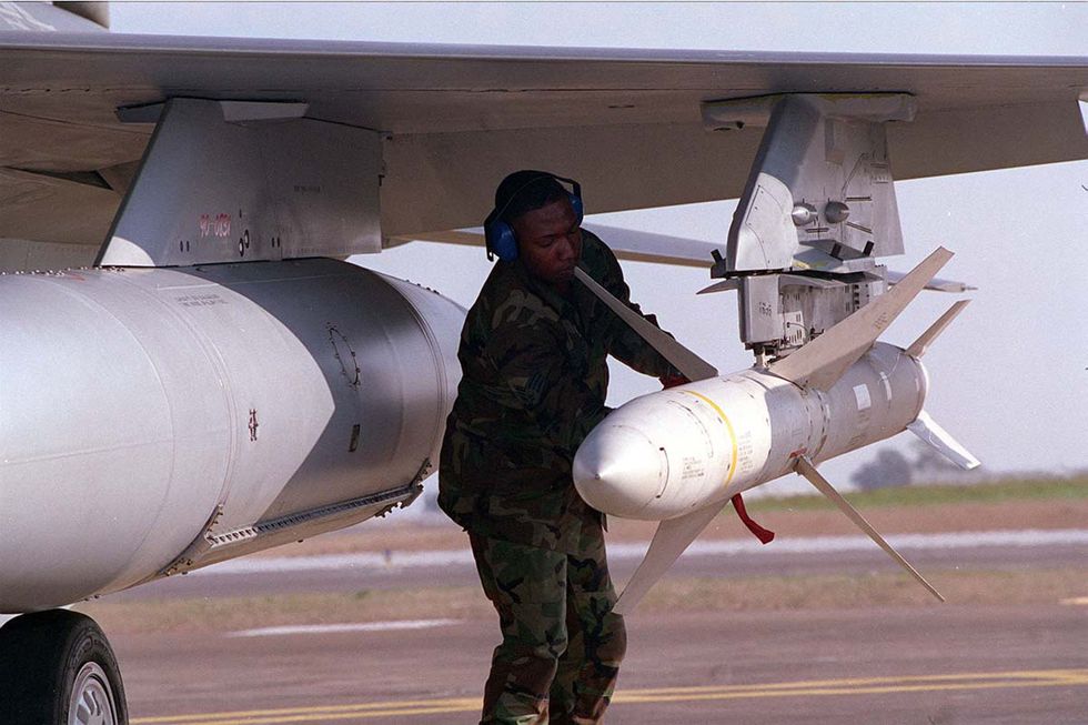 weapons technician anthony toliver secures a agm 88 high speed anti radiation missile harm at th