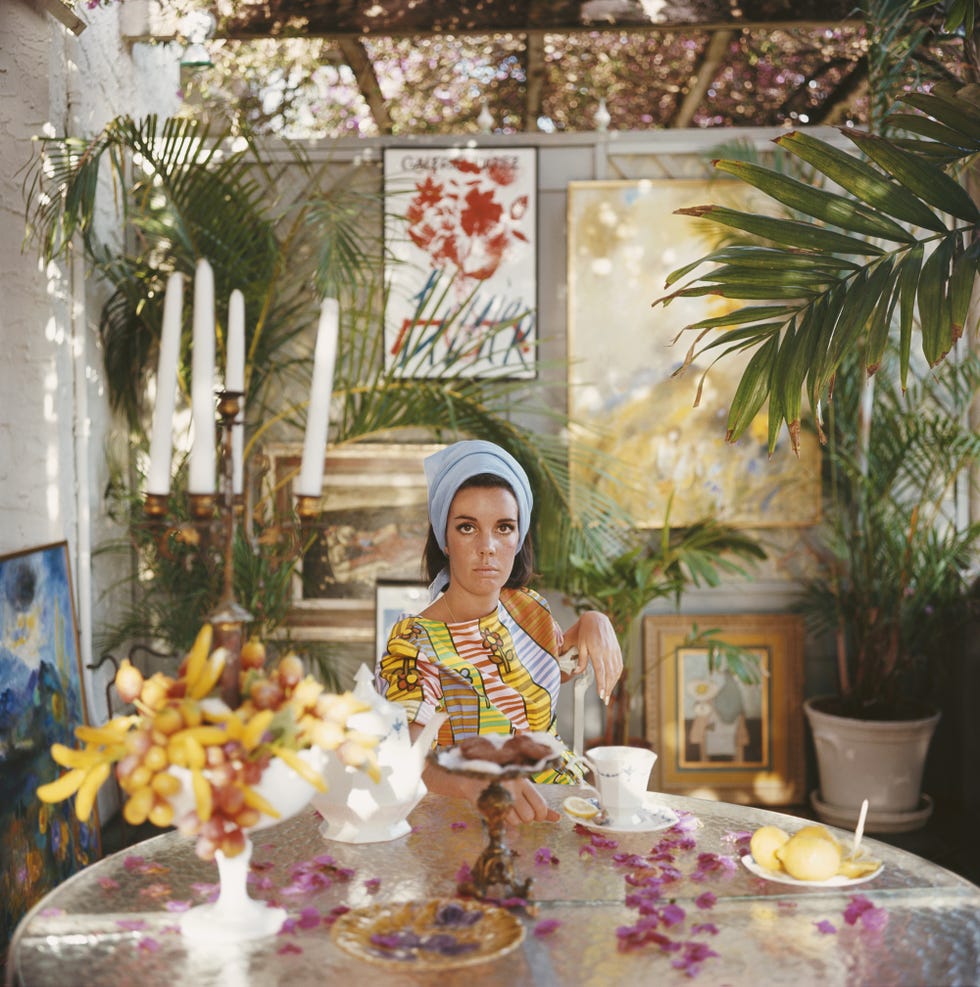 A vibrant indoor setting with a decorative table featuring fruit and a drink