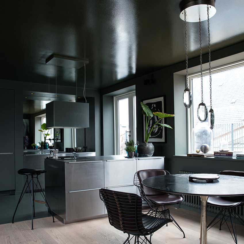 Black and an amazing fir green velvet sofa conjured up magic in this home in Copenhagen. First featured in the January 2017 ‘Winter Living’ edition of ELLE Decoration.