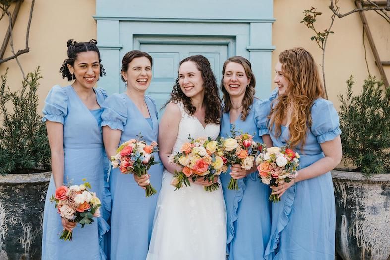 the writer pictured as a bridesmaid with a bride and three others